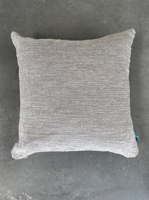 Gray textured pillow on a gray background