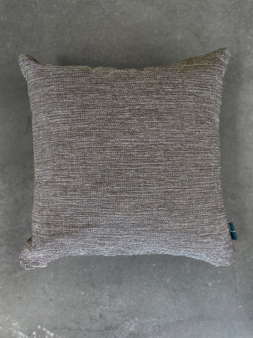 Textured gray pillow on a gray background